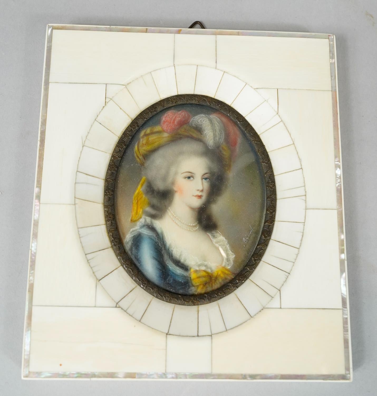 A 19th century ivory mosaic and mother of pearl framed miniature on ivory, depicting a young lady in