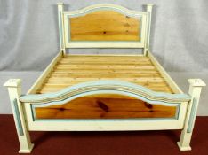 A contemporary painted pine bedstead for a 5ft mattress.
