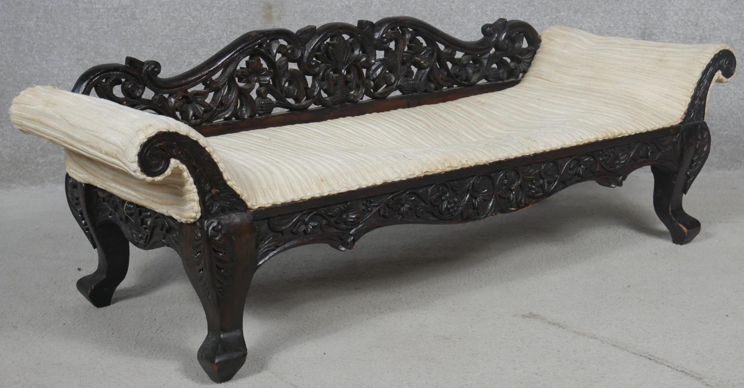 A miniature Burmese hardwood double end chaise longue with all over carved and pierced decoration. - Image 2 of 4