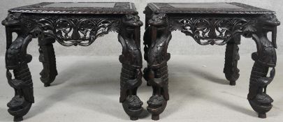 A pair of Burmese hardwood side tables with all over pierced and carved decoration raised on