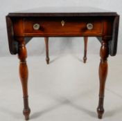 A 19th century mahogany drop flap Pembroke table with frieze drawer on turned tapering supports. H.