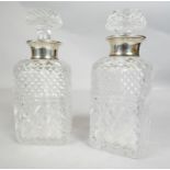 Two silver collared cut crystal decanters (one with original stopper). Hallmarked R&D for