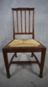 A C.1900 oak Arts and Crafts pot cupboard along with a late 19th century rush seated dining chair.