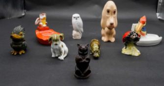 A collection of figures. Including a Royal Copenhagen Denmark Snowy Owl figure, a Beswick hand