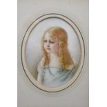 A 19th century framed and glazed miniature on ivory of a little girl with blonde hair and