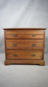 A late 19th century satin walnut chest of drawers on bracket feet. H.83 W.90 D.52