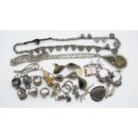 A collection of silver and white metal jewellery. Including a silver, garnet and citrine abstract