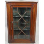 A 19th century oak hanging corner cabinet with astragal glazed doors. H.108 W.75 D.42cm