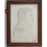 A framed 19th century carved ivory plaque of a relief profile of Napoleon, signed J. Kinder,