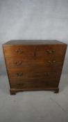 A Georgian mahogany chest of drawers with brass swan neck handles on shaped bracket feet. H.108 W.