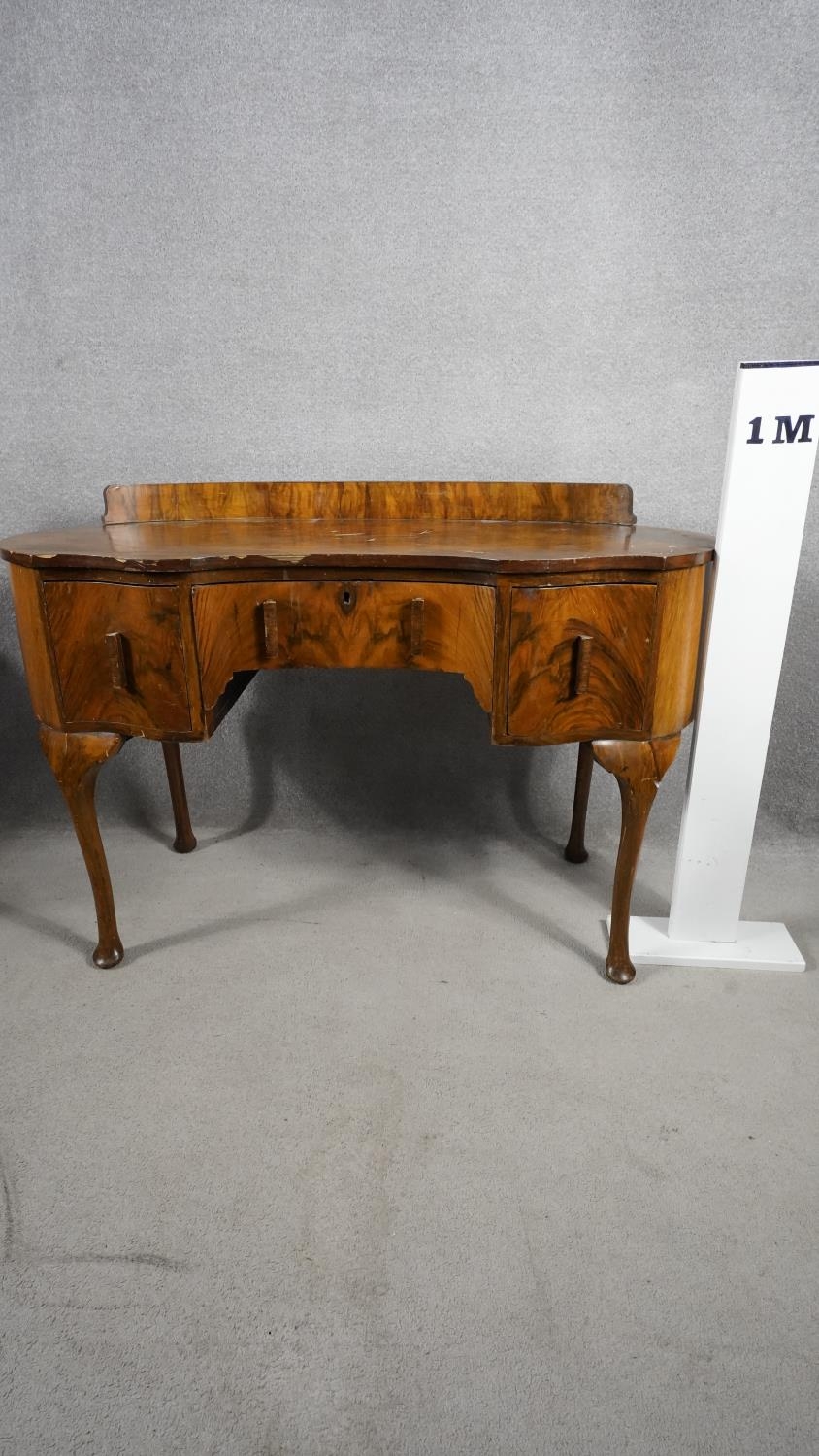 A mid century figured walnut Queen Anne style dressing table. H.88 W.121 D.52 (with faults as - Image 6 of 6