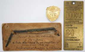A silver gilt Poetry Society shield brooch, a brass ticket tag from the Metropolitan Opera,
