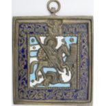 An antique Russian enamelled brass icon depicting St George killing the dragon with cyrillic writing