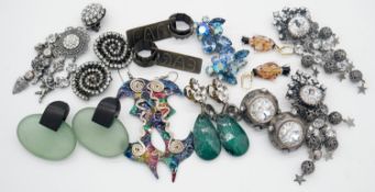 A collection of nine pairs of costume and statement earrings. Including two pairs of crystal set