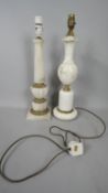 Two vintage white marble and gilt metal column table lamps. The gilt metal detailing with stylised