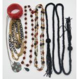 A collection of costume jewellery. Including an agate bead statement bracelet, an Art Deco black