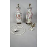 Two hand painted Chinese porcelain vases converted into lamps, each mounted on a wooden base. One