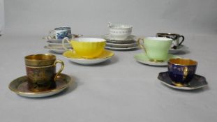A collection of seven teacups and saucers and other saucers. Including a Fitz and Floyd orchid