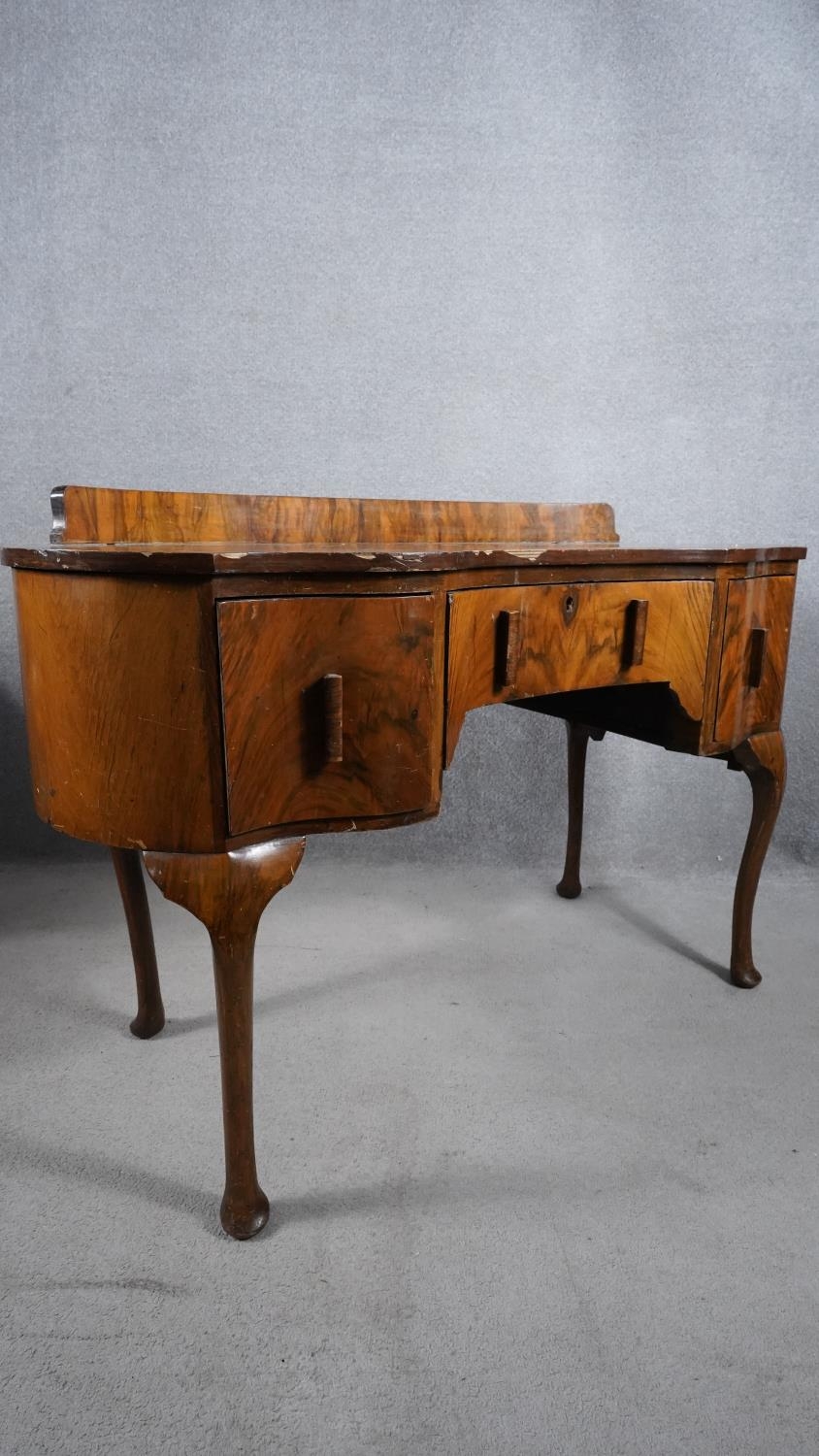 A mid century figured walnut Queen Anne style dressing table. H.88 W.121 D.52 (with faults as - Image 2 of 6