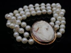 A 14 carat rose and yellow shell cameo and three strand cultured pearl bracelet. The push clasp, a