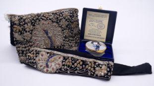 A vintage silver and gold thread embroidered Indian peacock and floral design clutch bag and