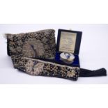 A vintage silver and gold thread embroidered Indian peacock and floral design clutch bag and