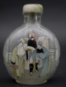 A Chinese reverse painted snuff bottle with jade and ivory stopper. Painted with a theatre scene