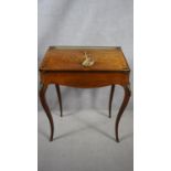 A late 19th century rosewood Louis XV style bureau de dame with pierced brass back rail and fall