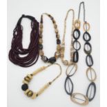 A collection of horn and bone necklaces. Including a vintage faceted horn graduated bead necklace, a