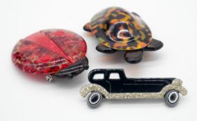 Three Lea Stein style acrylic vintage brooches. One of a tortoise with bakelite tortoiseshell