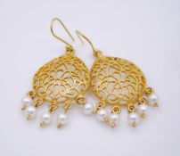 A pair of gold plated and cultured pearl pierced foliate design drop earrings. L.6cm