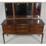 A vintage mahogany Stag furniture dressing table with triple adjustable mirrors. H.127 W.131 D.50cm