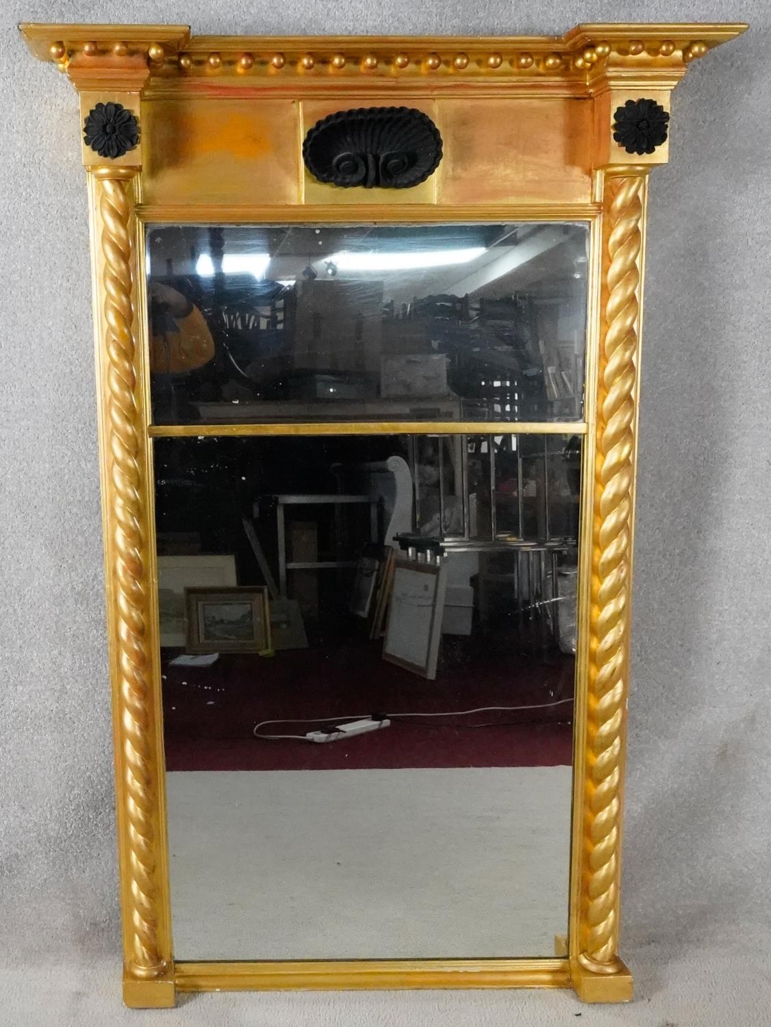 A Regency giltwood full height pier mirror with ball decorated architectural cornice above