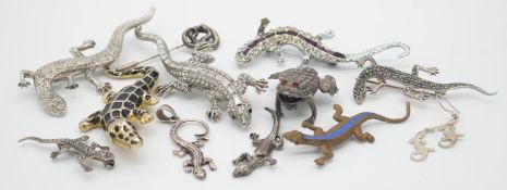 A collection of reptile and amphibian jewellery. Including seven lizard brooches, some silver, a