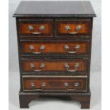 A small Georgian style mahogany crossbanded chest of drawers on bracket feet. H.62 W.46 D.33cm