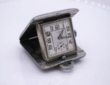 An Art Deco square metal Fiat Swiss ladies purse clock, with two dials and illuminated numbers,