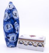 A Japanese ceramic blue and white abstract design ovoid vase, signed to the base along with a