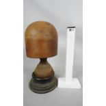 A 19th century carved wooden milliners hat stand with turned base and sitting on ebony plinth.