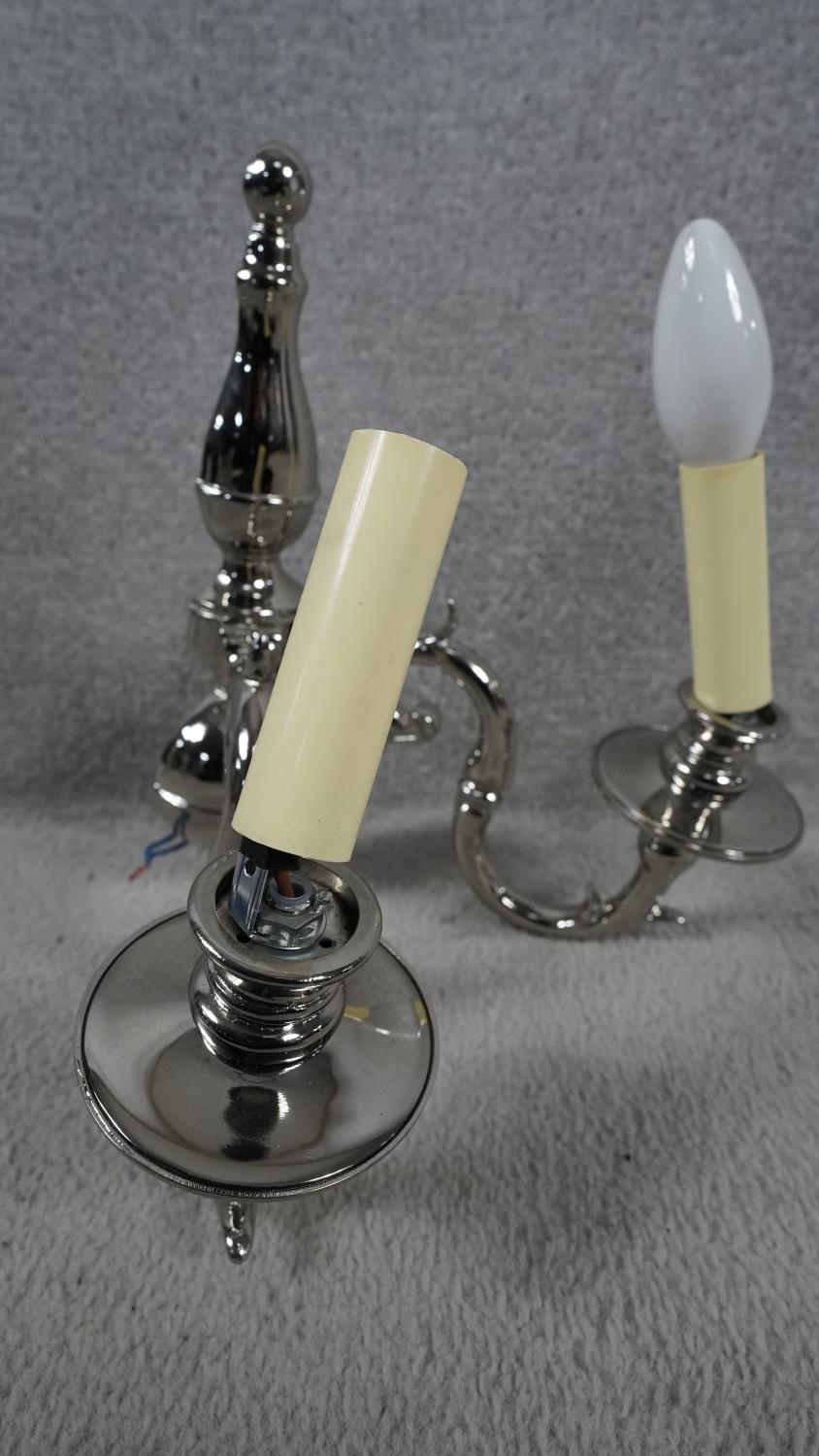 A set of four metal twin sconce wall candelabras with scrolling foliate arms. H.31 W.29 - Image 5 of 8