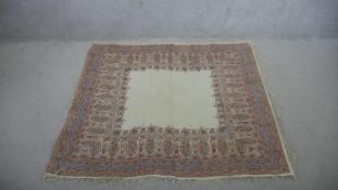 A 19th century hand woven woollen shawl with floral and boteh motifs. H.114 W.151