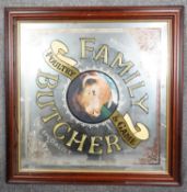 A framed mirrored family butcher, poultry & game advertising sign, with carved gilded letters and