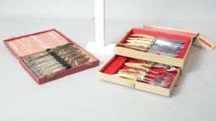 A leather effect cased repousse floral design silver handled six person fish cutlery set and a boxed
