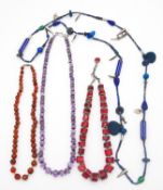 A collection of four gemstone necklaces. Including A graduated antique Carnelian bead necklace, a