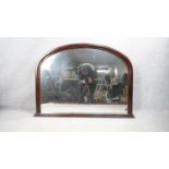 A 19th century style overmantel mirror in arched mahogany frame on stepped plinth base. H.82 W.105