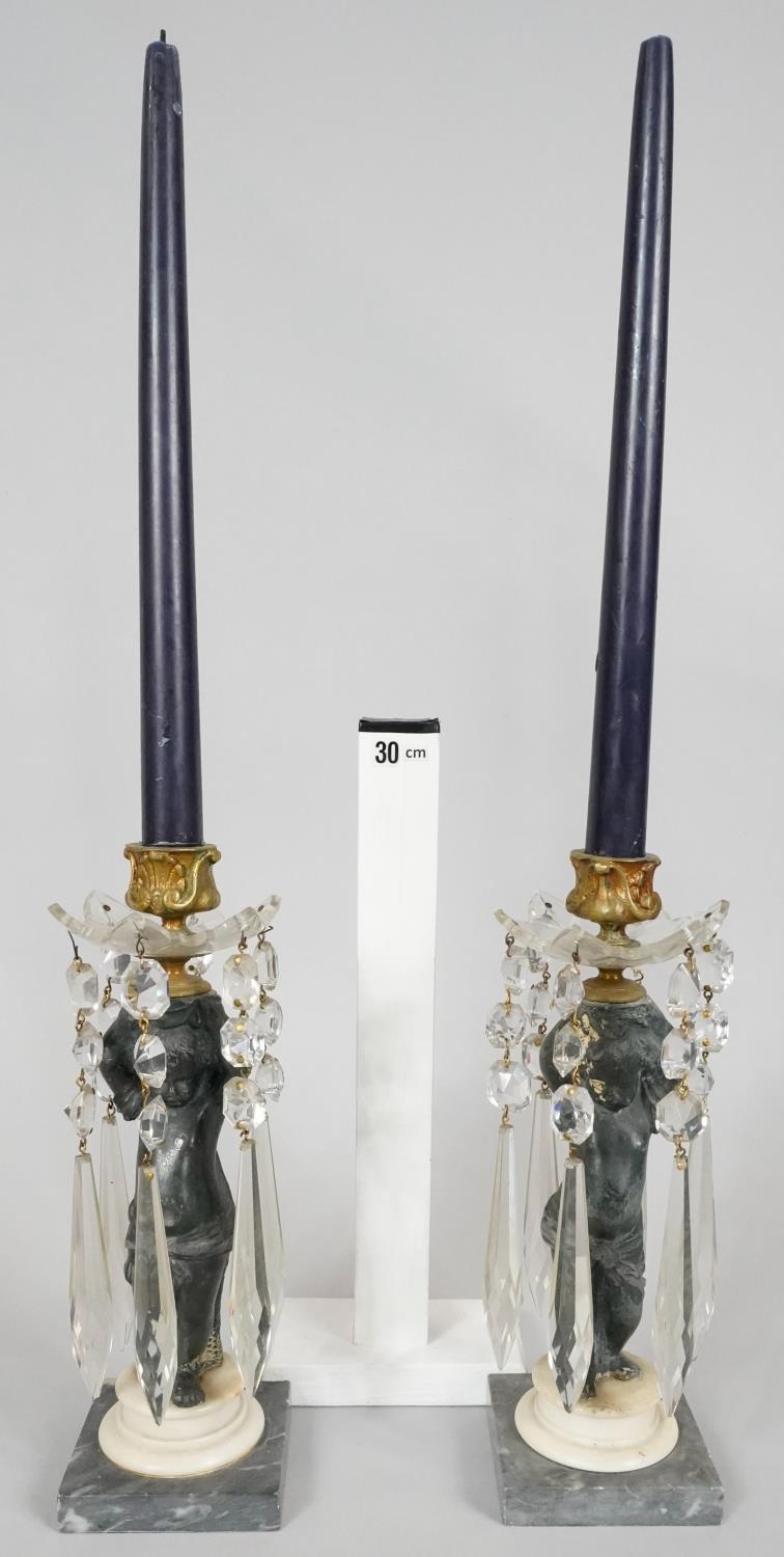 A pair of 19th century candelabras with gilt metal mounts and putti holding the flame aloft with cut - Image 2 of 4