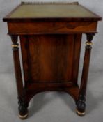 A Regency rosewood Davenport with pierced brass top rail above leather lined writing slope revealing