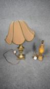 An antique marble and gilt metal table along with a brass twin handled table lamp on four lion paw