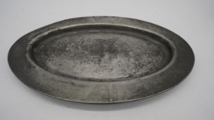 An antique oval pewter platter, circa 1800. Stamped for James Yates Pewter, Birmingham, England.