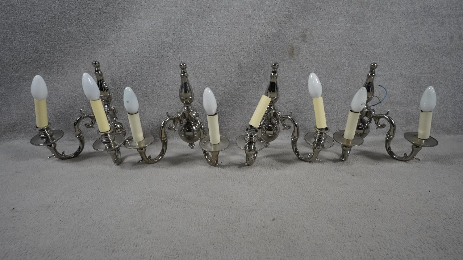 A set of four metal twin sconce wall candelabras with scrolling foliate arms. H.31 W.29 - Image 2 of 8