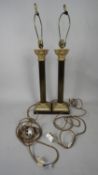A pair of contemporary metal Corinthian column design table lamps on square bases with brass